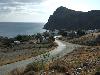 Anblick von Lentas (S�dk�ste) - im Hintergrund der namensgebende Felsen, der vom Meer her wie ein L�we aussieht.